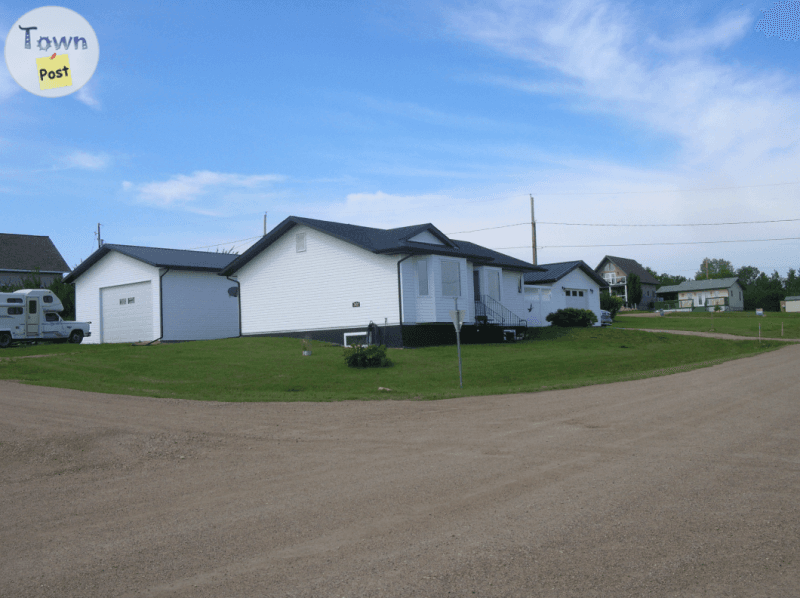 Photo of House, garage and large rv storage shed or shop.