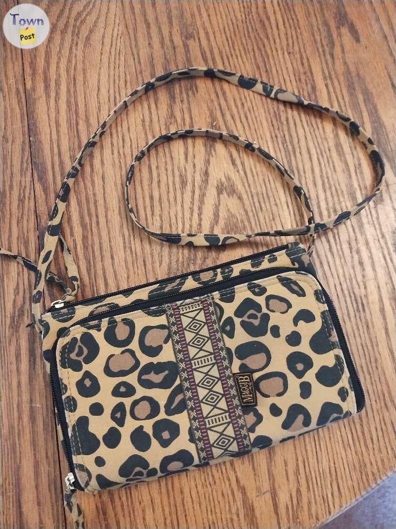 Photo of 2 purses and a bottle carrier