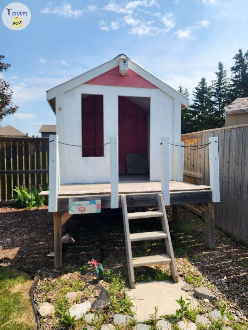 Photo of Wooden kids playhouse