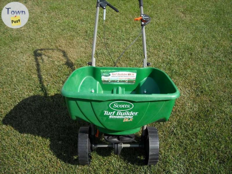 Photo of SCOTTS FERTILIZER/GRASS SPREADER*****USED ONE TIME