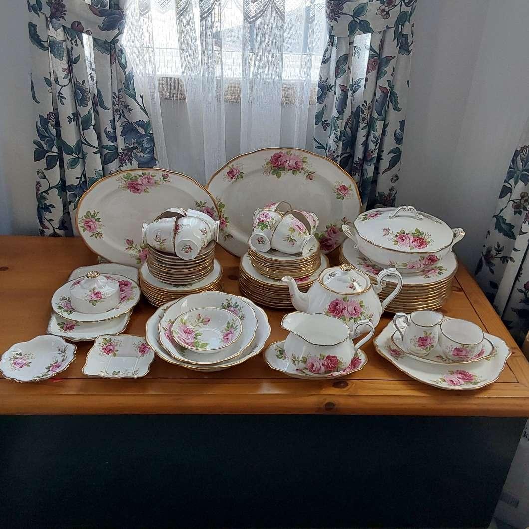 Photo of Royal Albert American Beauty 10 settings, teapot, 2 platters, covered casserole, vegetable bowl, salad bowl, cream and sugar, cake plate and more. 